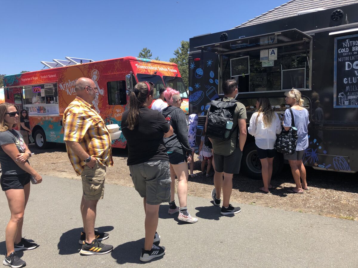 The wait for fresh vegan doughnuts at the Donuttery food truck takes about 40 minutes at the Vegan Food Popup in Encinitas.