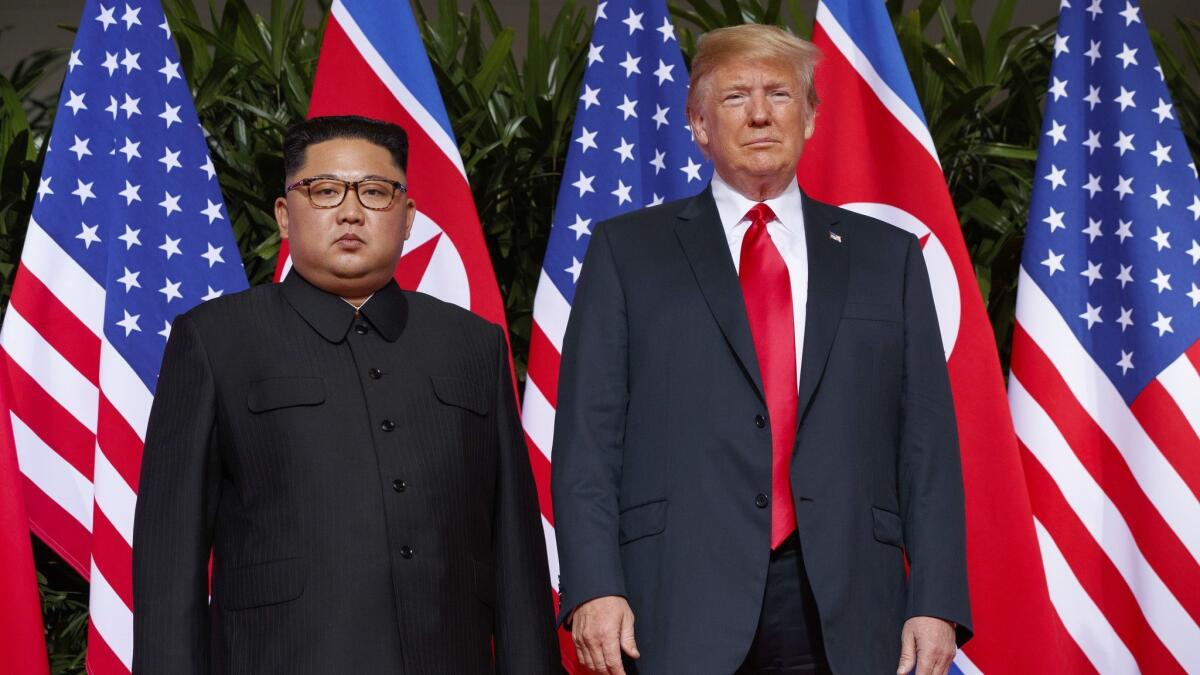 President Trump meets with North Korean leader Kim Jong Un on Sentosa Island, in Singapore, in June. The Trump administration has imposed sanctions on three foreign companies it says helped North Korea with illicit trade.