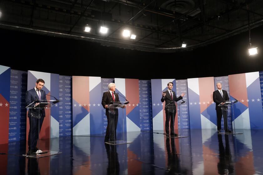 Republican Kevin Kiley, second from right, speaks as from left to right, Democrat Kevin Paffrath and Republicans John Cox and Kevin Faulconer listen during a debate between candidates for the upcoming California recall election, held by KCRA 3 and the San Francisco Chronicle in Sacramento, Calif., on Wednesday, Aug. 25, 2021. (Scott Strazzante/San Francisco Chronicle via AP, Pool)