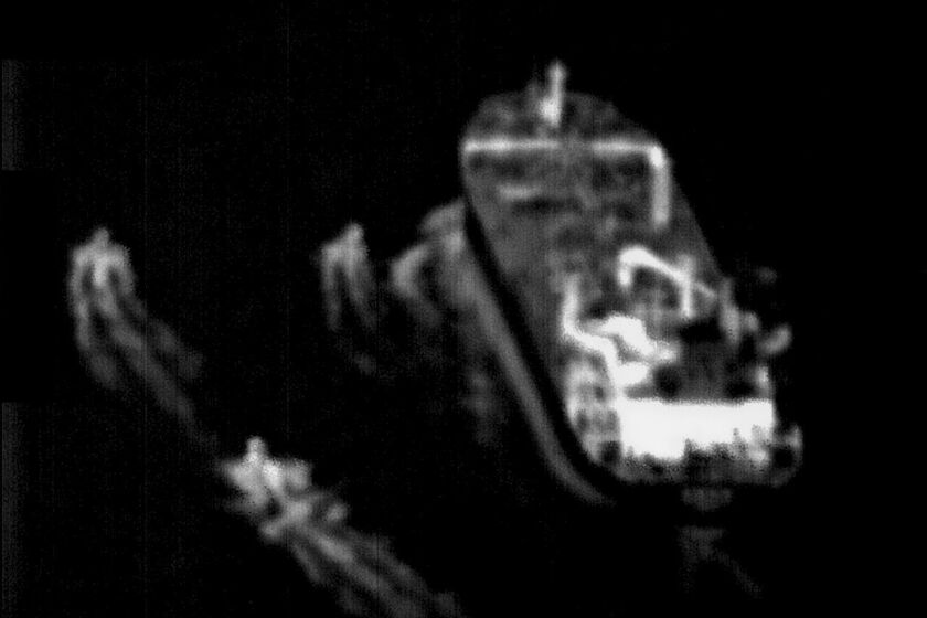 This still image taken from surveillance video from a U.S. Navy Boeing P-8 Poseidon shows three Iranian Revolutionary Guard fast-attack vessels near a commercial ship in the Strait of Hormuz Sunday, June 4, 2023. The U.S. Navy said Monday, June 5, its sailors and the United Kingdom Royal Navy came to the aid of a ship in the crucial Strait of Hormuz after Iran's Revolutionary Guard "harassed" it. Iran did not immediately acknowledge the incident. (U.S. Navy via AP)