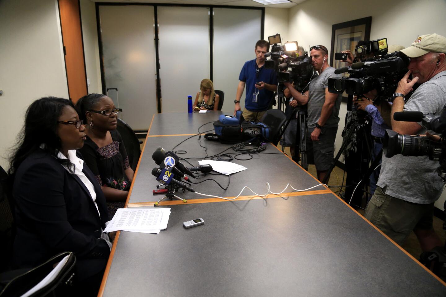 Marlene Pinnock, right, with her attorney Caree Harper as they address the media after the CHP announced a $1.5 million settlement in the civil rights lawsuit.