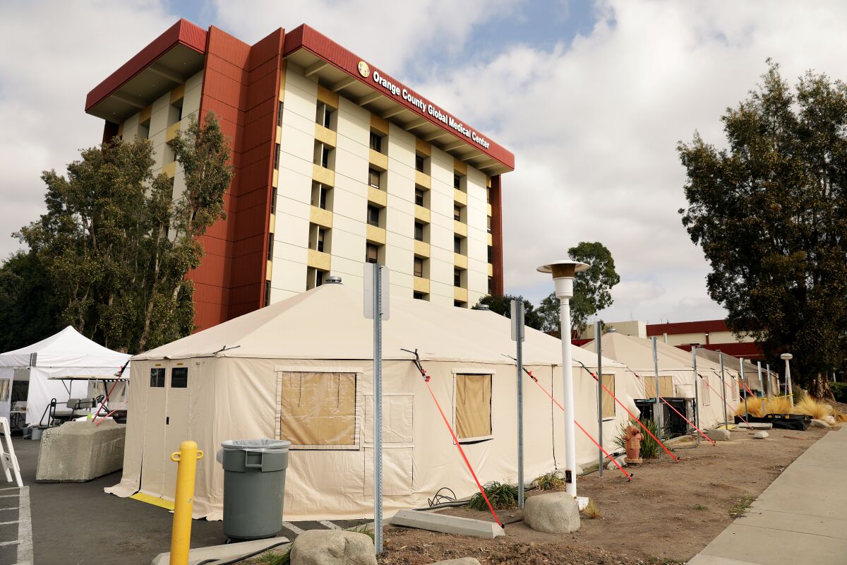 Triage tents are set up outside Orange County Global Medical Center in Santa Ana on Friday.