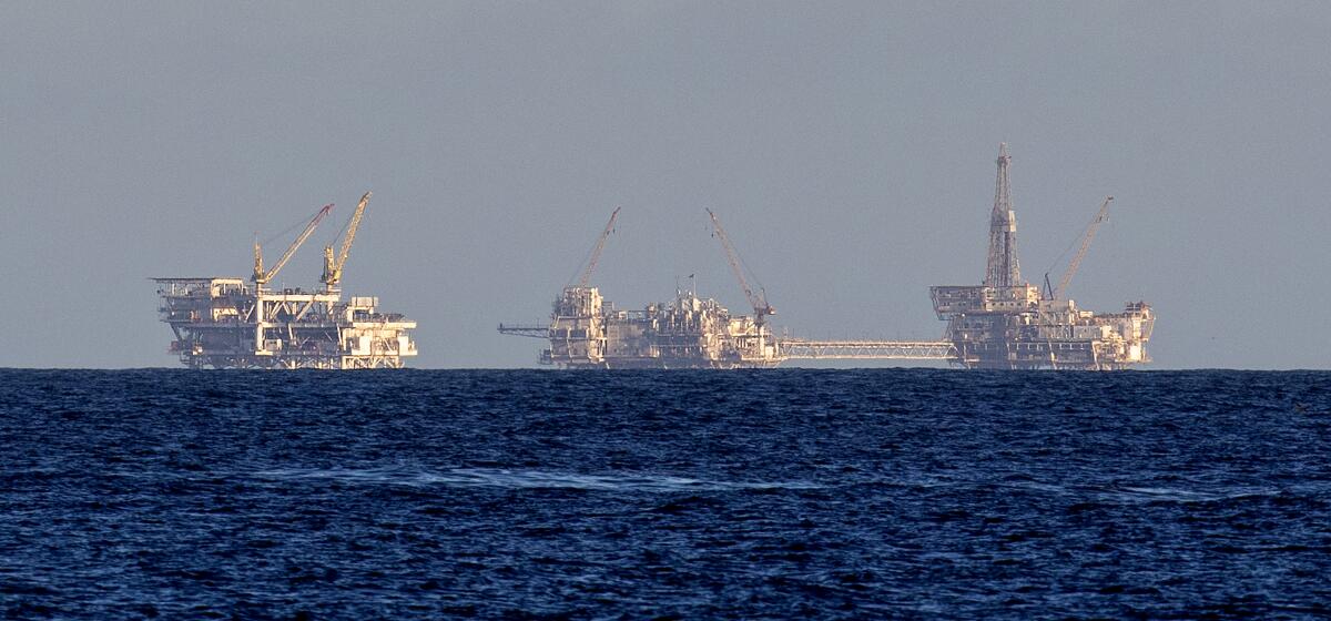 Oil and gas platforms Edith, from left, Elly, Ellen are seen off the Southern California coast.