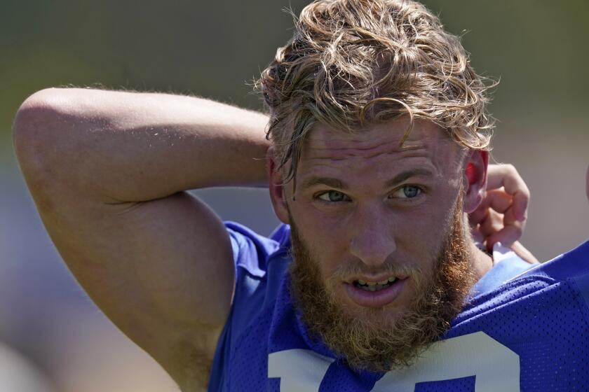 Los Angeles Rams wide receiver Cooper Kupp takes his jersey off after an NFL mini camp football practice Tuesday, June 7, 2022, in Thousand Oaks, Calif. (AP Photo/Mark J. Terrill)