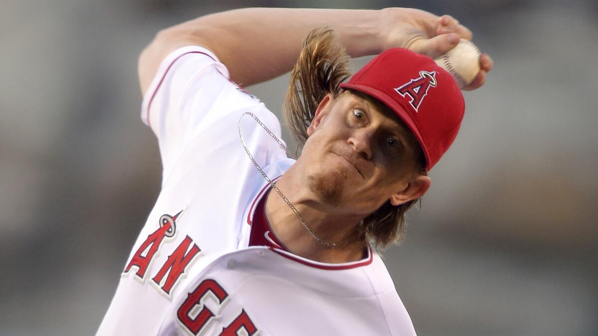 Angels starter Jered Weaver delivers a pitch during the first inning of the team's 4-3 win over the Philadelphia Phillies on Wednesday.