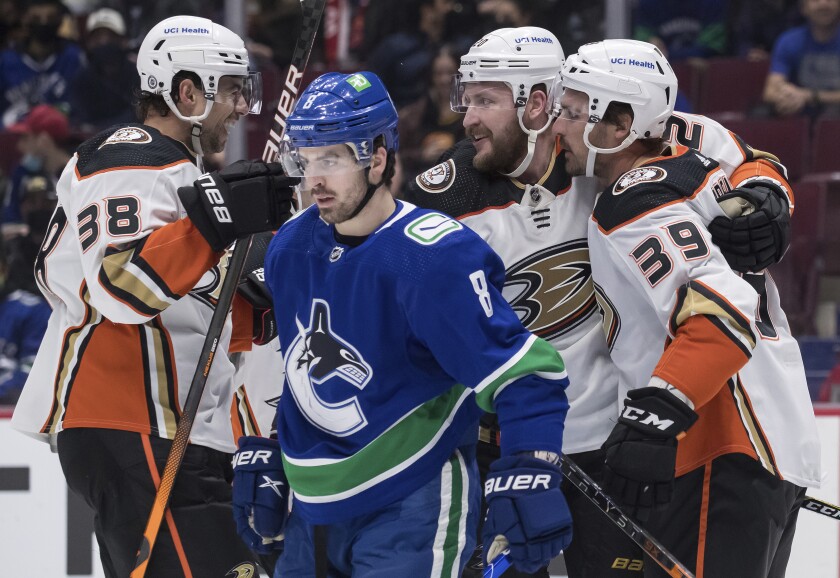 From left at top, the Ducks' Derek Grant, Nicolas Deslauriers and Sam Carrick celebrate Deslauriers' first-period goal.