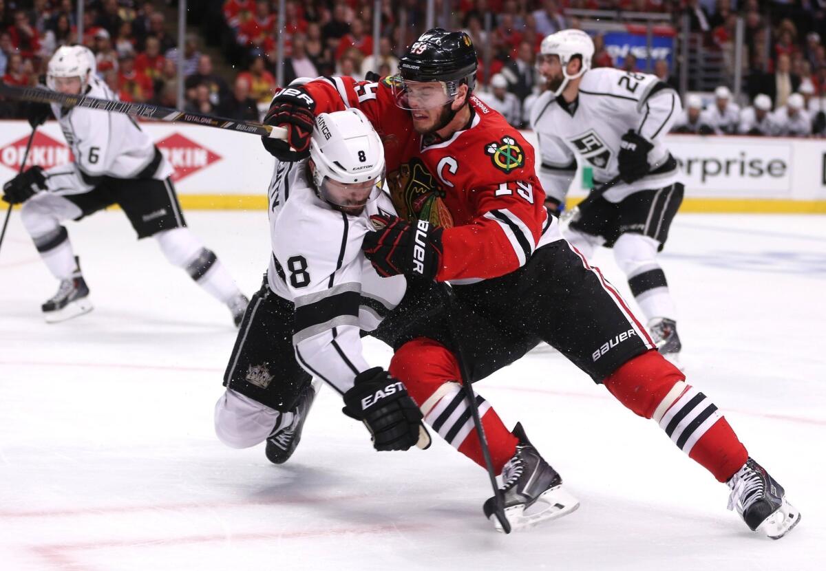 Kings defenseman Drew Doughty, left, collides with Blackhawks center Jonathan Toews in a Western Conference playoff game.