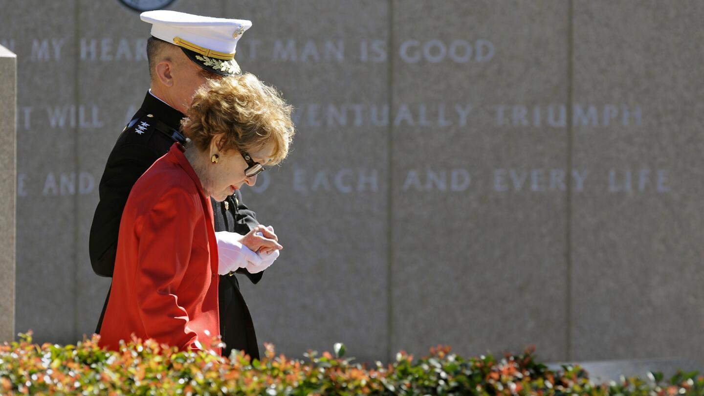 Nancy Reagan is helped by Marine Lt. Gen. George J. Flynn as she arrives for a wreath-laying ceremony at her husband's memorial at the Reagan Presidential Library in Simi Valley.