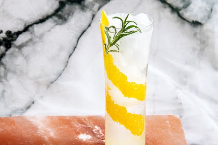 Garnish the drink with a rosemary sprig for extra freshness.