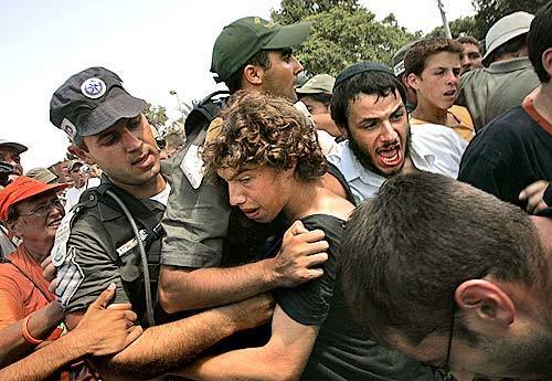 Protesters and police clash outside the Gaza settlement of Neve Dekalim as authorities attempt to deliver eviction notices.