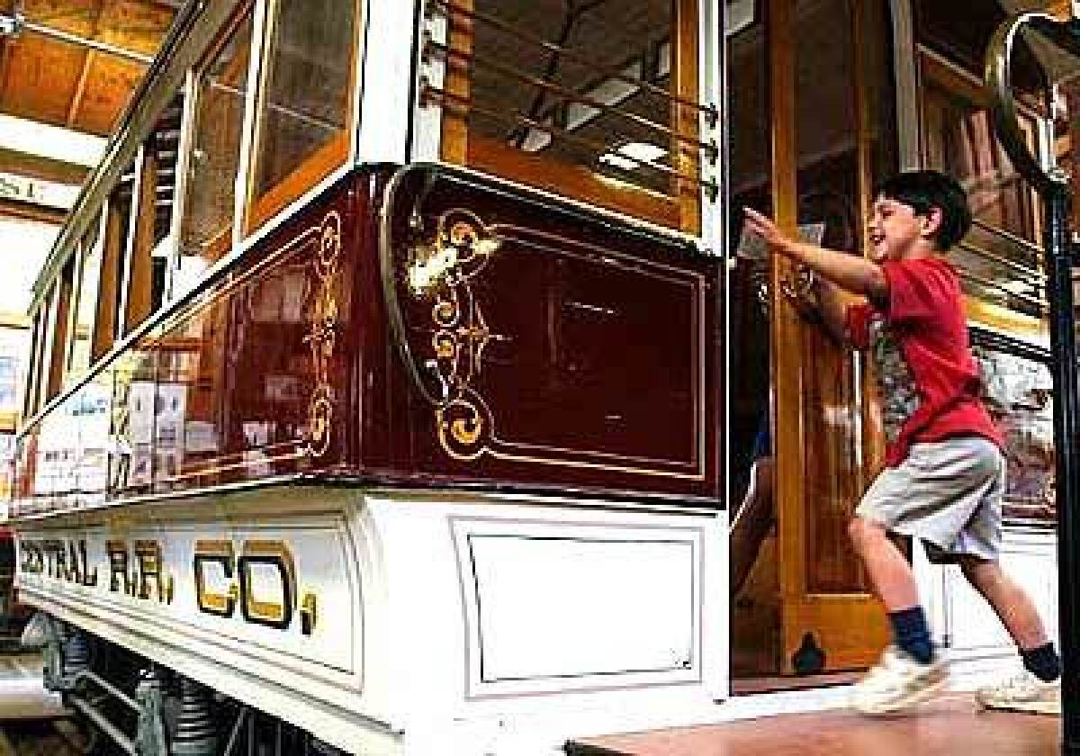 Alexander Baer, 4, of Los Altos, Calif., plays on a restored historic trolley at the Kelley History Park in San Jose.