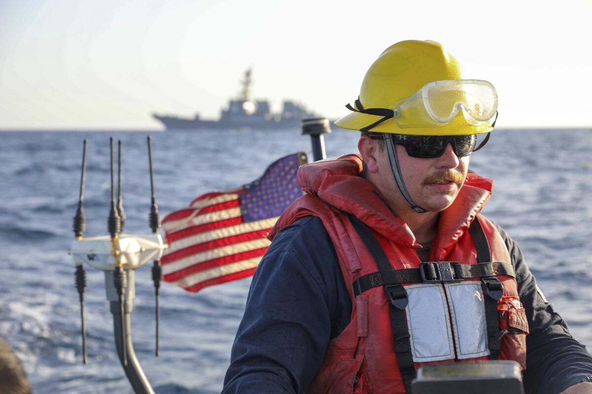 FILE - In this photo released by the U.S. Navy, Boatswain's Mate 2nd Class Hunter Pemberton, assigned to the USS Cole, takes part in an exercise on the Red Sea, March 29, 2022. Mohammed Abdul-Salam, Yemen's Houthi chief negotiator and spokesman, said late Friday, April 15, that the U.S. move in the Red Sea, which comes amid a cease-fire in the country's civil war, contradicts Washington’s claim of supporting the U.N.-brokered truce. (Mass Communication Specialist Seaman Christopher Stachyra/U.S. Navy via AP, File)