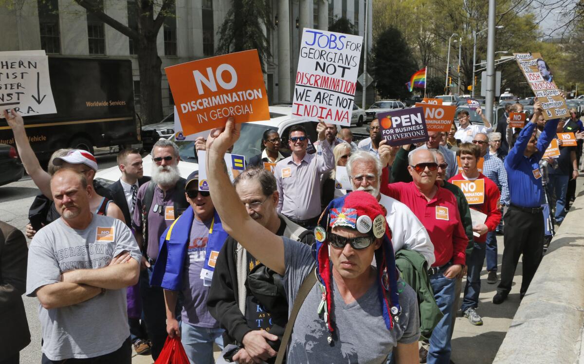 Demonstrators march in Atlanta against a religious freedom bill that they say would allow discrimination against gays and lesbians. The bill died in the Legislature on Thursday.