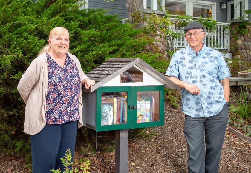 Jenni and Eric Busboom with their Little Free Library at 1370 Wilbur Ave.