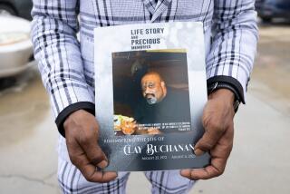 LOS ANGELES, CA - SEPTEMBER 02: Christopher C. Buchanan holds a funeral service program for his older brother Clay Buchanan at True Everfaithful Baptist Church in Los Angeles, CA on Saturday, Sept. 2, 2023. Clay Buchanan, 50, was killed in August when someone set his vehicle on fire while he slept in South L.A. (Myung J. Chun / Los Angeles Times)