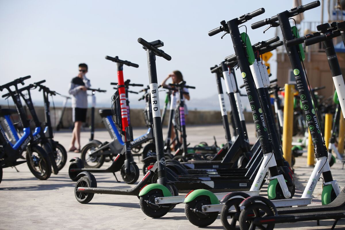 Dockless e-scooters along the Mission Beach boardwalk 