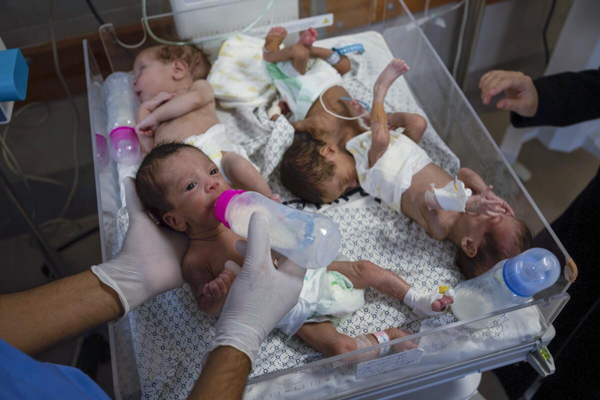 Medics prepare premature babies for transport to Egypt after they were evacuated from Shifa Hospital in Gaza City.