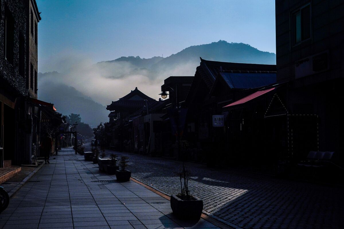 A street in front of Hakindang House with morning fog at Jeonju Hanok Village in Jeonju, South Korea.