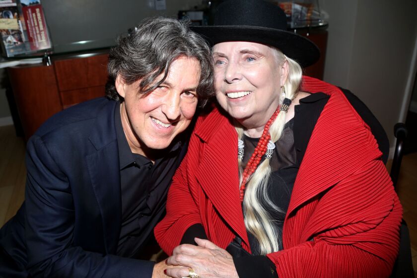 Music legend Joni Mitchell (right) and "Almost Famous" film director and writer Cameron Crowe (left) have been friends since the late 1970s. They are shown here at San Diego's Old Globe theater following the Sept. 27 world premiere of the musical version of "Almost Famous."