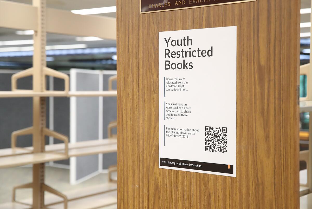 Empty shelves are shown in the youth restricted books area at the Huntington Beach Public Library on Tuesday.