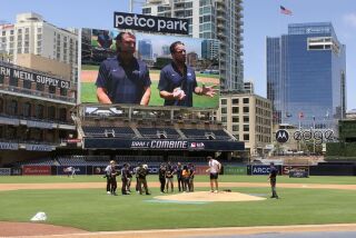 Jake Peavy, standing next to Trevor Hoffman, speaks from Petco Park on MLB Network broadcast during 2022 MLB Draft Combine.