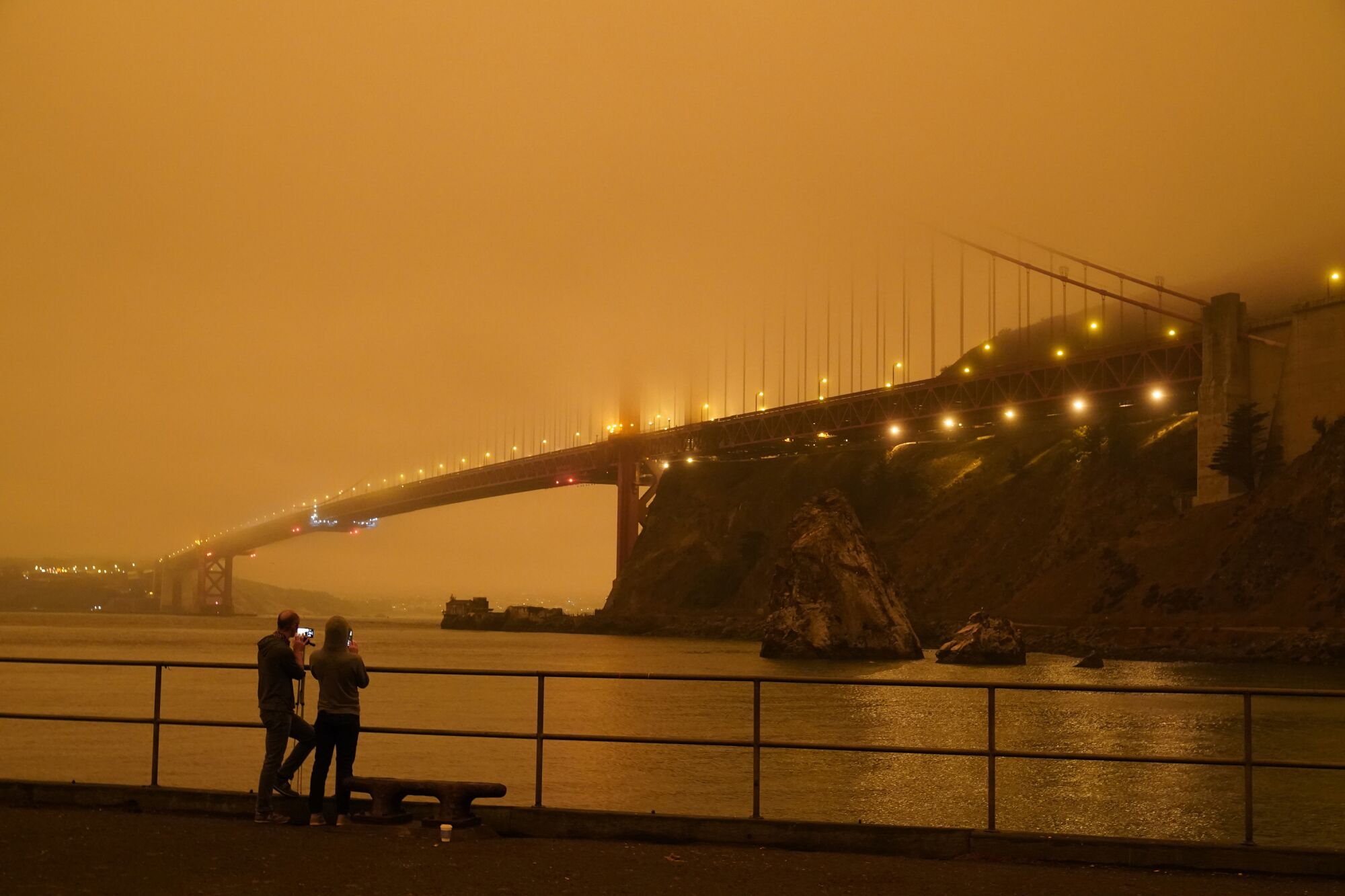 Fog and wildfire smoke hide much of the Golden Gate Bridge on Wednesday morning.