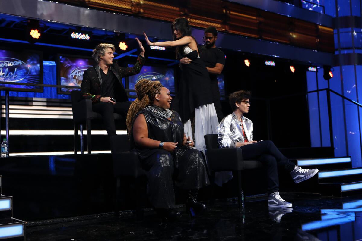 "American Idol" contestants, from left, Dalton Rapattoni, La"Porsha Renae, Sonika Vaid and MacKenzie Bourg take a seat during a dress rehearsal for the March 24 episode at CBS Television City in Hollywood.