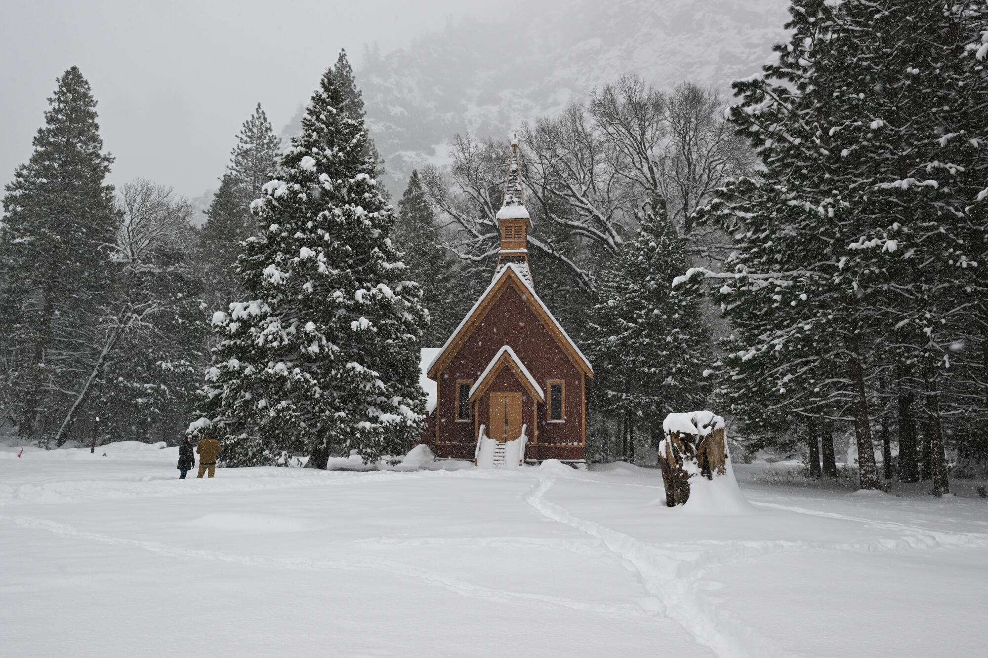 Yosemite Valley Chapel is seen as snow blankets Yosemite National Park.