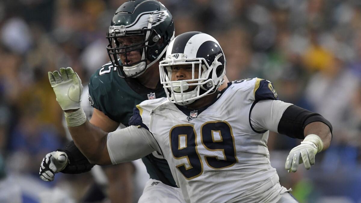 In this Dec. 10, 2017, file photo, Rams defensive lineman Aaron Donald, right, gets past Philadelphia Eagles offensive lineman Lane Johnson.