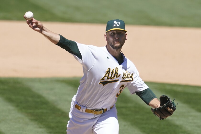 Oakland Athletics' James Kaprielian pitches against the Kansas City Royals during the fifth inning of a baseball game in Oakland, Calif., Saturday, June 12, 2021. (AP Photo/Jeff Chiu)