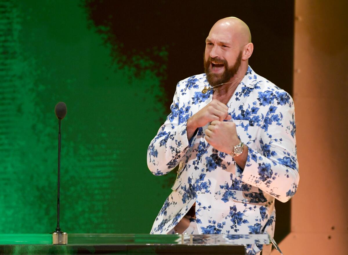 LAS VEGAS, NEVADA - OCTOBER 11: Heavyweight boxer Tyson Fury shadowboxes as he speaks at a WWE news conference at T-Mobile Arena on October 11, 2019 in Las Vegas, Nevada. Fury will face WWE wrestler Braun Strowman and WWE champion Brock Lesnar will take on former UFC heavyweight champion Cain Velasquez at the WWE's Crown Jewel event at Fahd International Stadium in Riyadh, Saudi Arabia on October 31. (Photo by Ethan Miller/Getty Images) ** OUTS - ELSENT, FPG, CM - OUTS * NM, PH, VA if sourced by CT, LA or MoD **