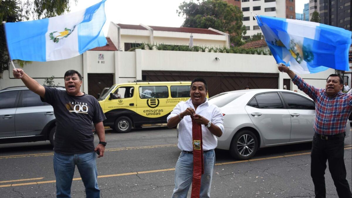 Men demonstrate in favor of the International Commission Against Impunity in Guatemala outside its headquarters in Guatemala City in August.