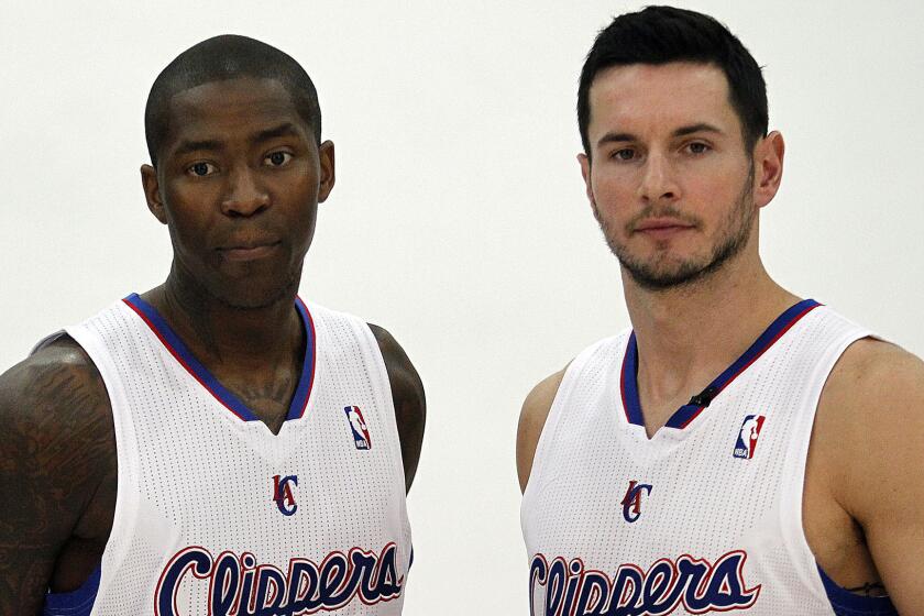 Clippers guard Jamal Crawford, left, and teammate J.J. Redick pose for a photo during the team's 2013 media day. Crawford and Redick have performed well in recent games.