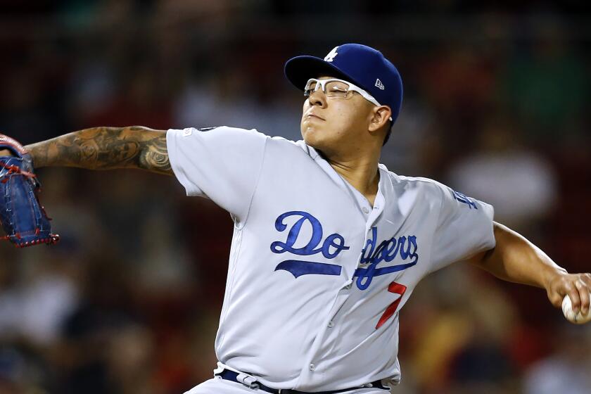 Los Angeles Dodgers' Julio Urias pitches against the Boston Red Sox during a baseball game in Boston, Monday, July 15, 2019. (AP Photo/Michael Dwyer)