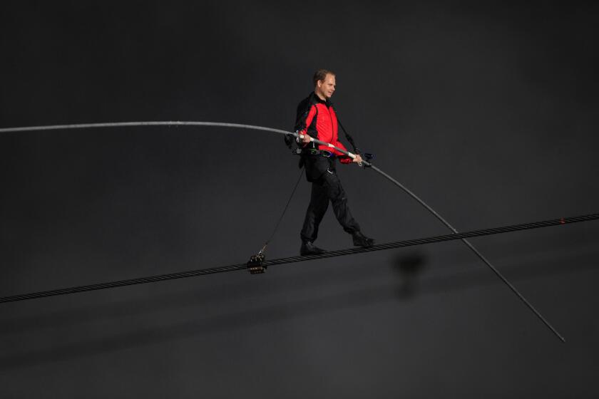 Nik Wallenda makes his historic walk on a wire across Niagara Falls.
