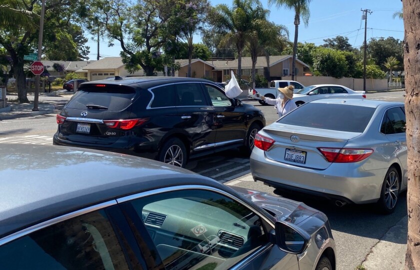 Some 300 area residents received free coronavirus testing Monday at Walker Elementary School in Santa Ana.