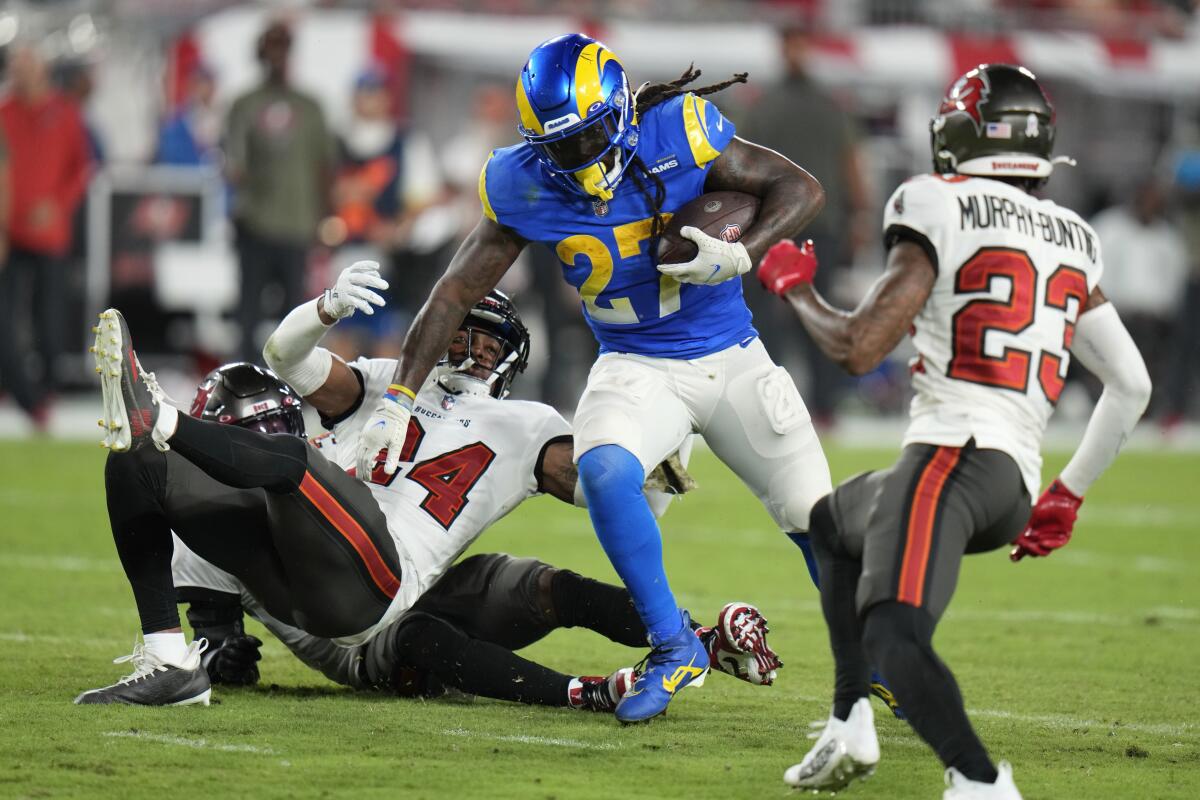 Rams running back Darrell Henderson Jr. carries the ball during the second half.