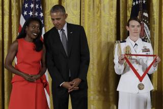 FILE - In this Sept. 22, 2016 file photo, President Barack Obama awards journalist and author, Isabel Wilkerson, the 2015 National Humanities Medal during a ceremony in the East Room of the White House, in Washington. Wilkerson's new book, her first since “The Warmth of Other Suns,” takes on what she is calling the country's caste system. The years-long project is called “Caste” and comes out Aug. 20, 2020. (AP Photo/Carolyn Kaster, File)