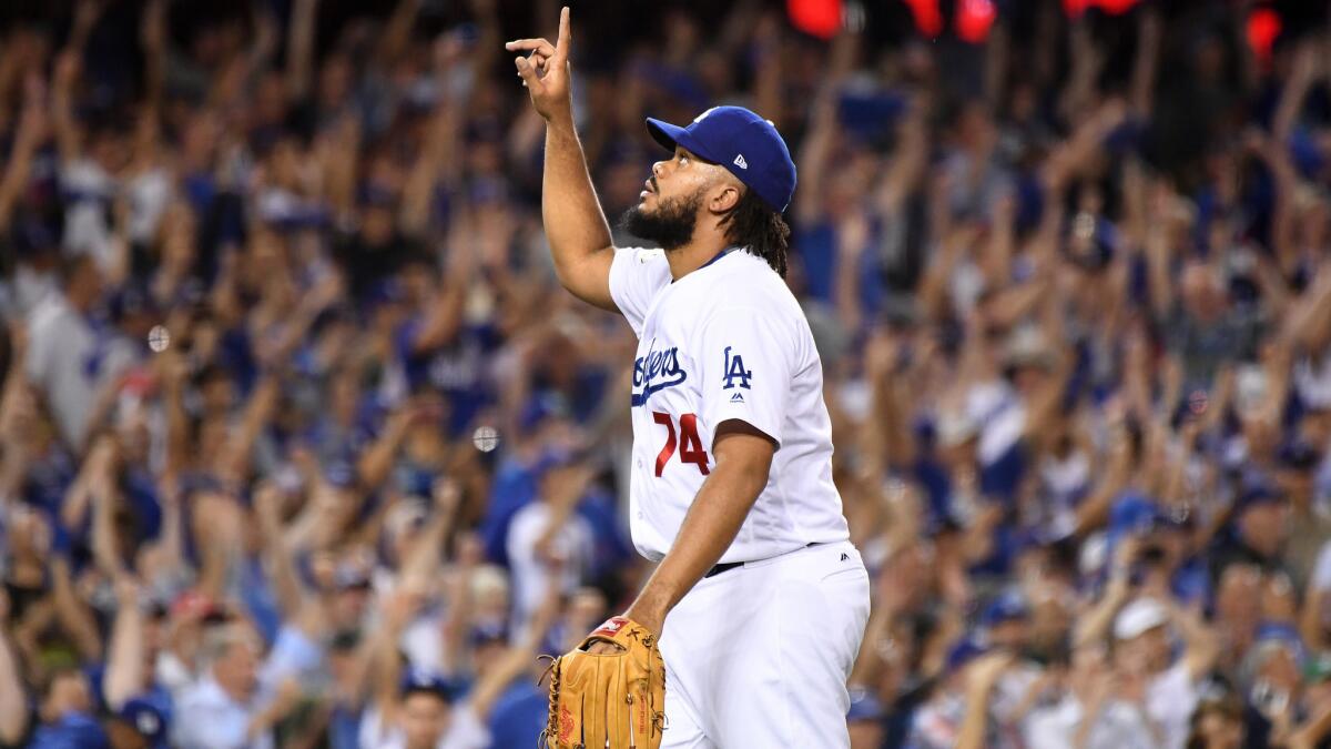 Kenley Jansen points up during a game.