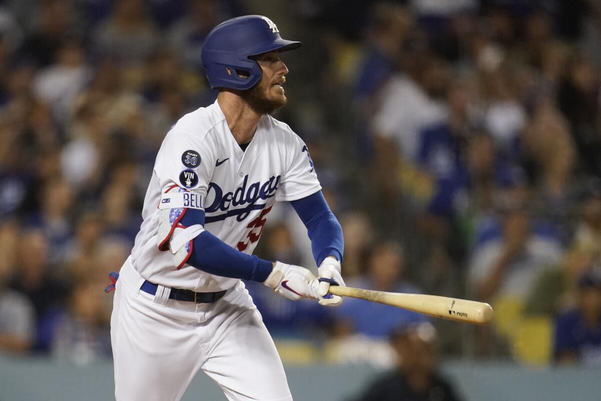 Cody Bellinger hits a sacrifice fly in the sixth inning for the Dodgers on Saturday.