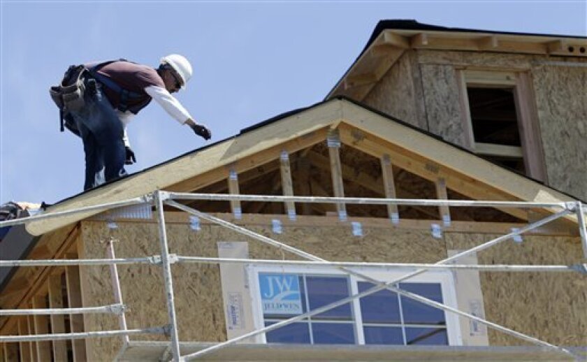 A roofer works on homes under construction in Sunnyvale. Silicon Valley tech companies are putting billions into housing.