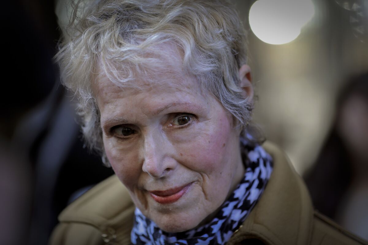 E. Jean Carroll talks to reporters outside a courthouse in New York.
