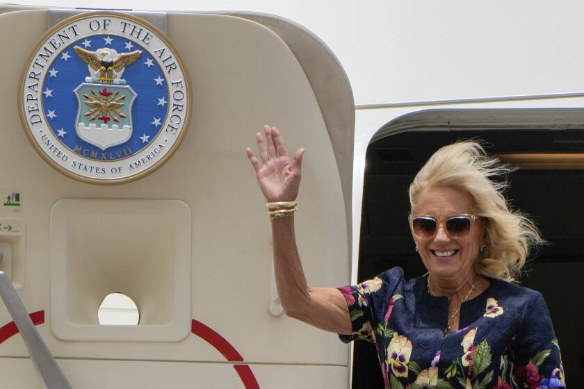 First Lady Jill Biden waves as she arrives at Cairo International Airport in Cairo, Friday, June 2, 2023. (AP Photo/Amr Nabil, Pool)