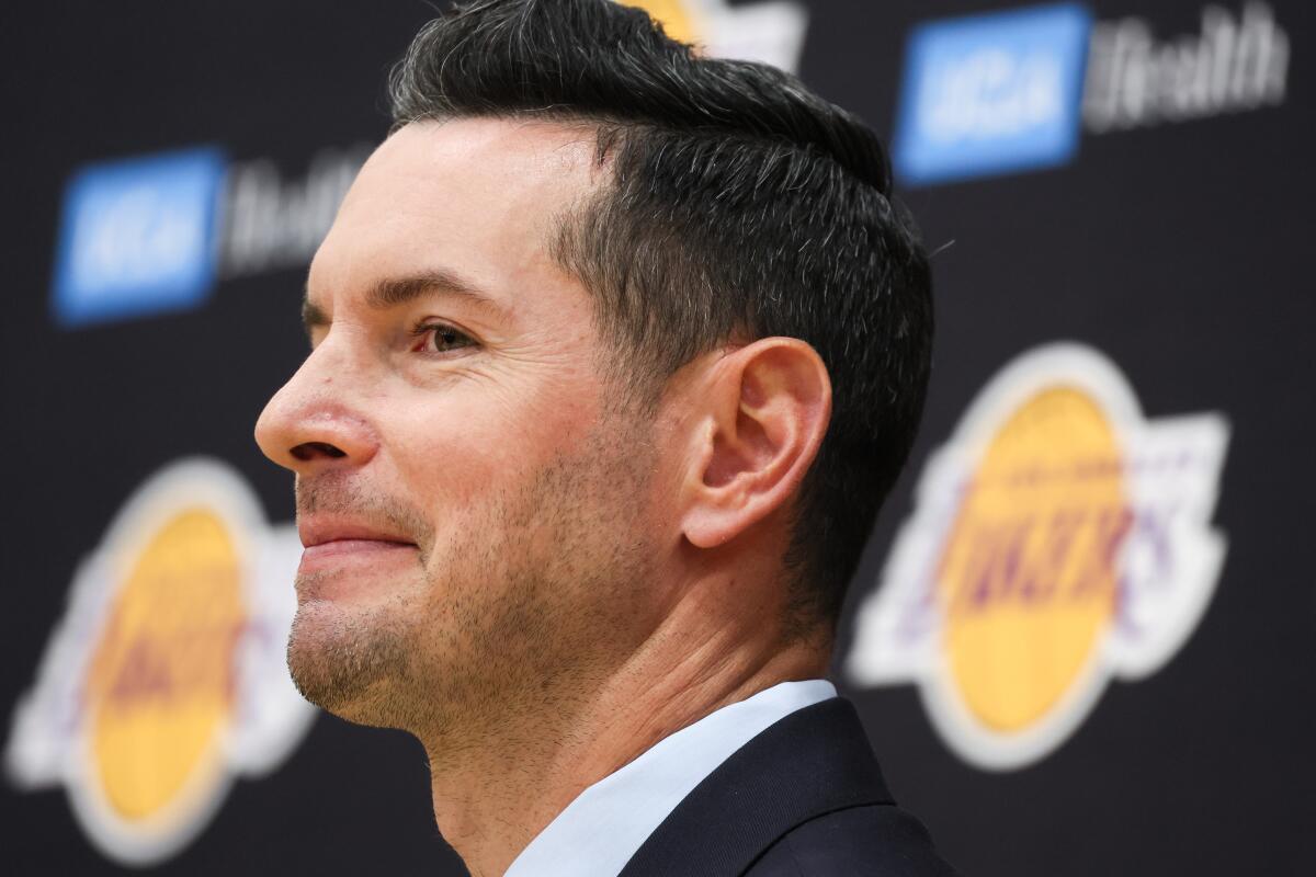 JJ Redick smiles as he is introduced as the Lakers' new head coach Monday at the team's training facility in El Segundo.