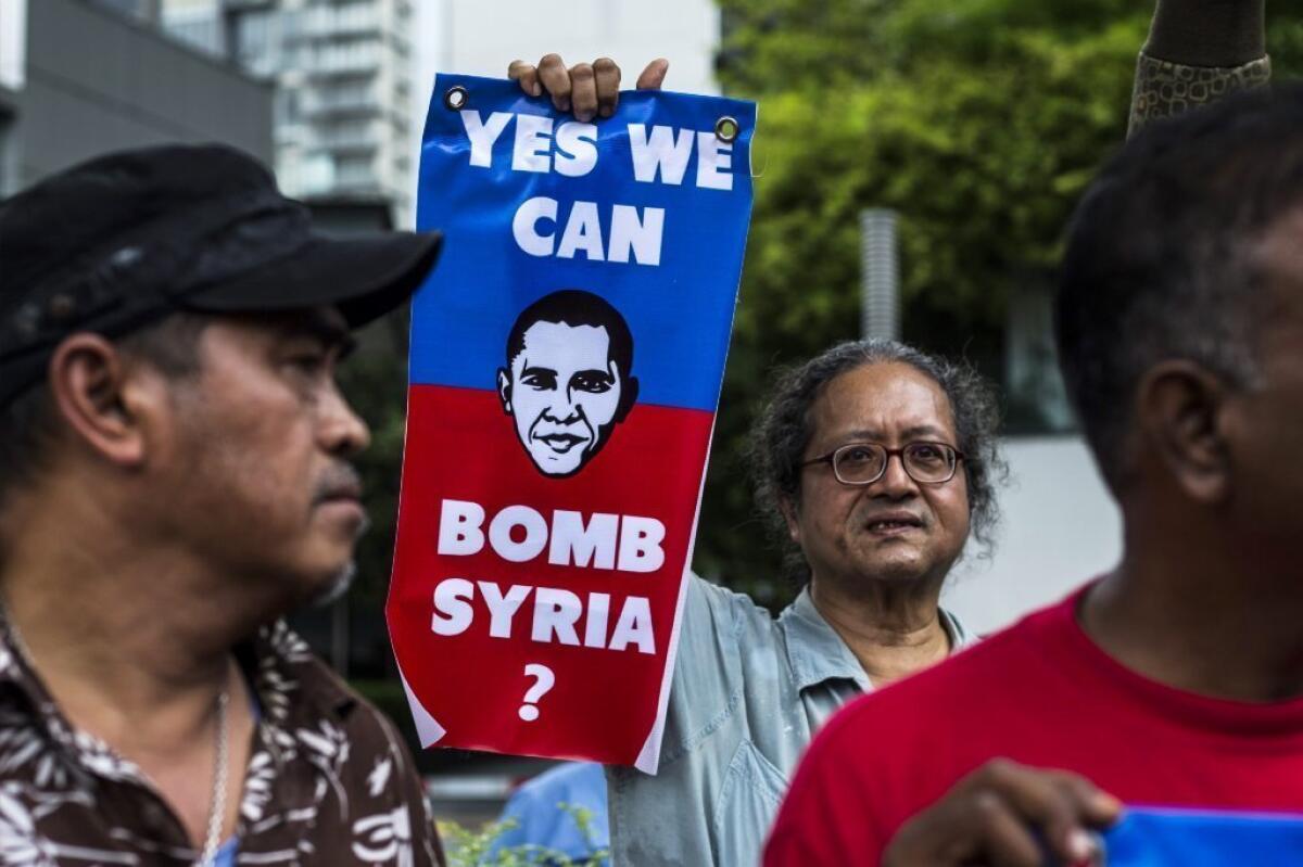 Malaysian activists protest against a possible military strike on Syria outside the U.S. embassy in Kuala Lumpur on Friday.