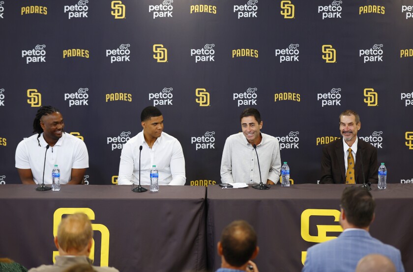 Padres GM A.J. Preller, second from right, speaks during press conference to introduce Josh Bell, left, and Juan Soto.