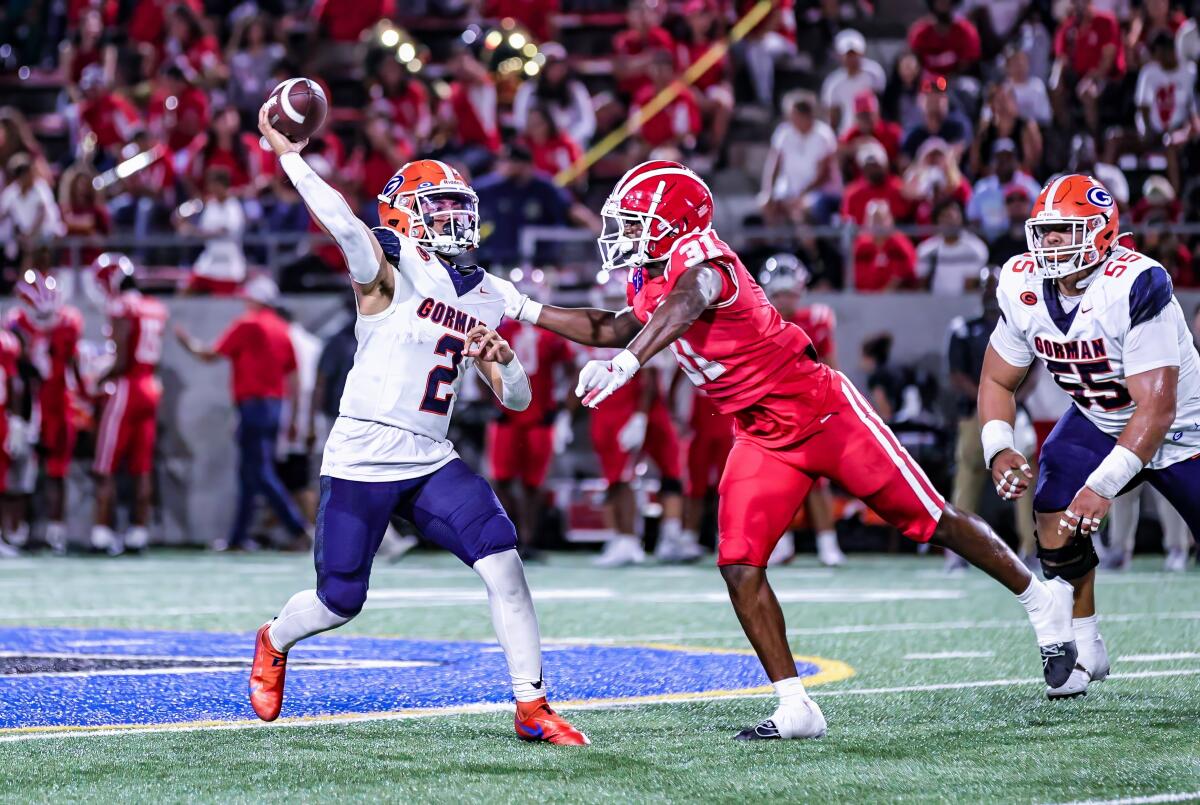 Mater Dei linebacker Nasir Wyatt pressures Bishop Gorman quarterback Melvin Spicer IV as he attempts a pass on Friday night.