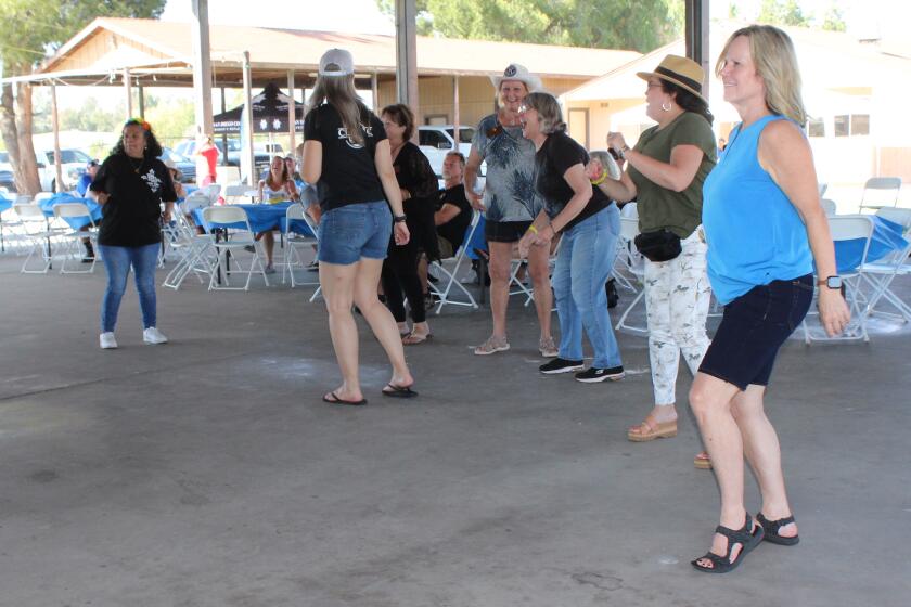 Dancers share a good time on the dance floor at Kiwanis Club of Ramona's 14th annual Music Fest on May 13.