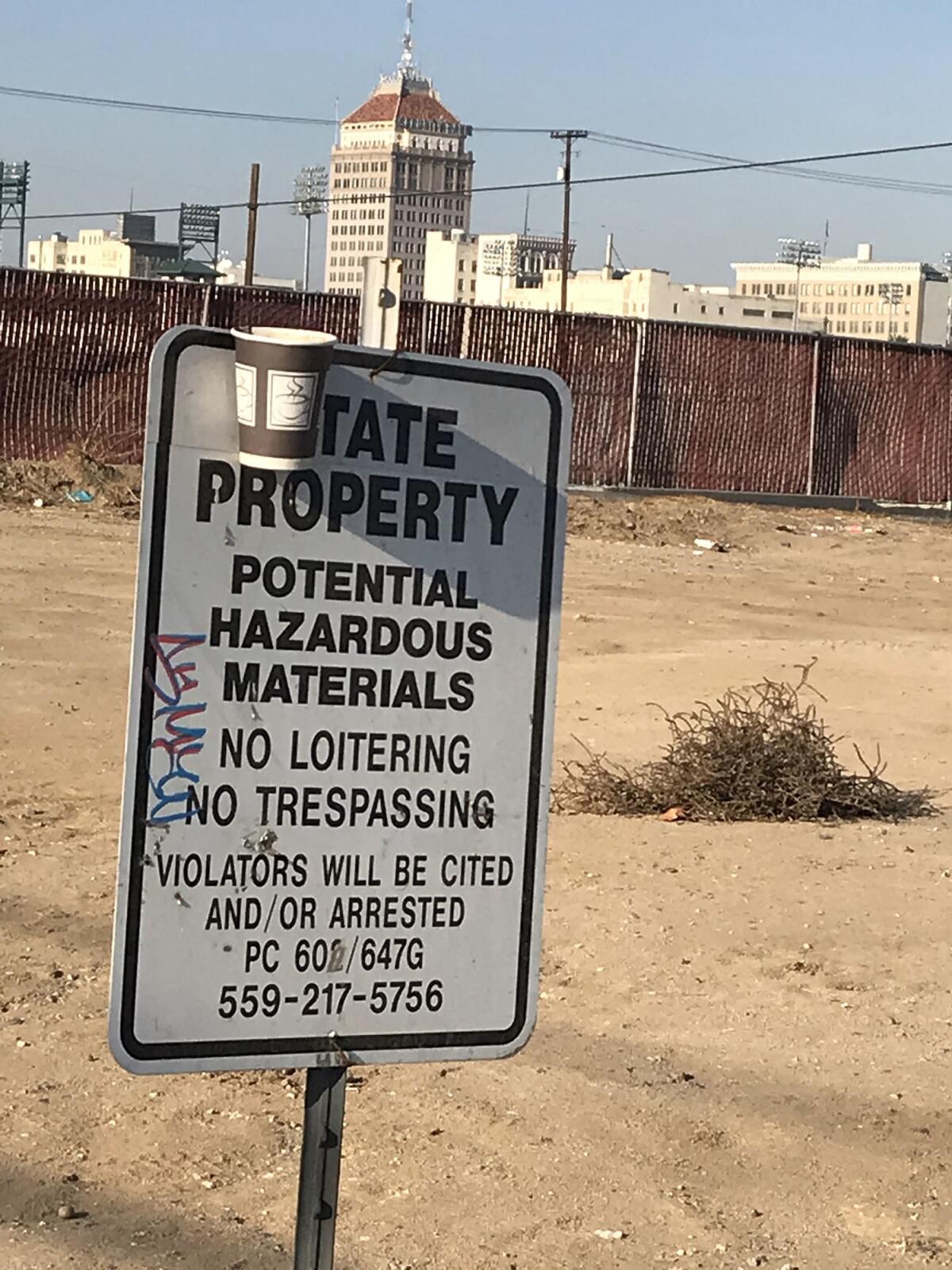 A sign at G and Tulare streets in Fresno marks state property.