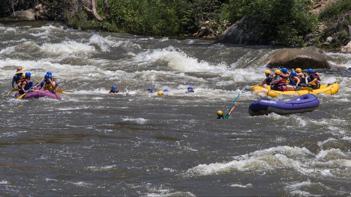 Rafters are dumped into the whitewater of the Ewings rapids after their raft overturned on the Kern River in Kernville on June 2.